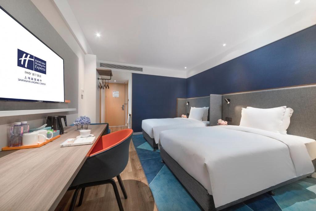 Postel nebo postele na pokoji v ubytování Holiday Inn Express Shanghai Jiading Center by IHG