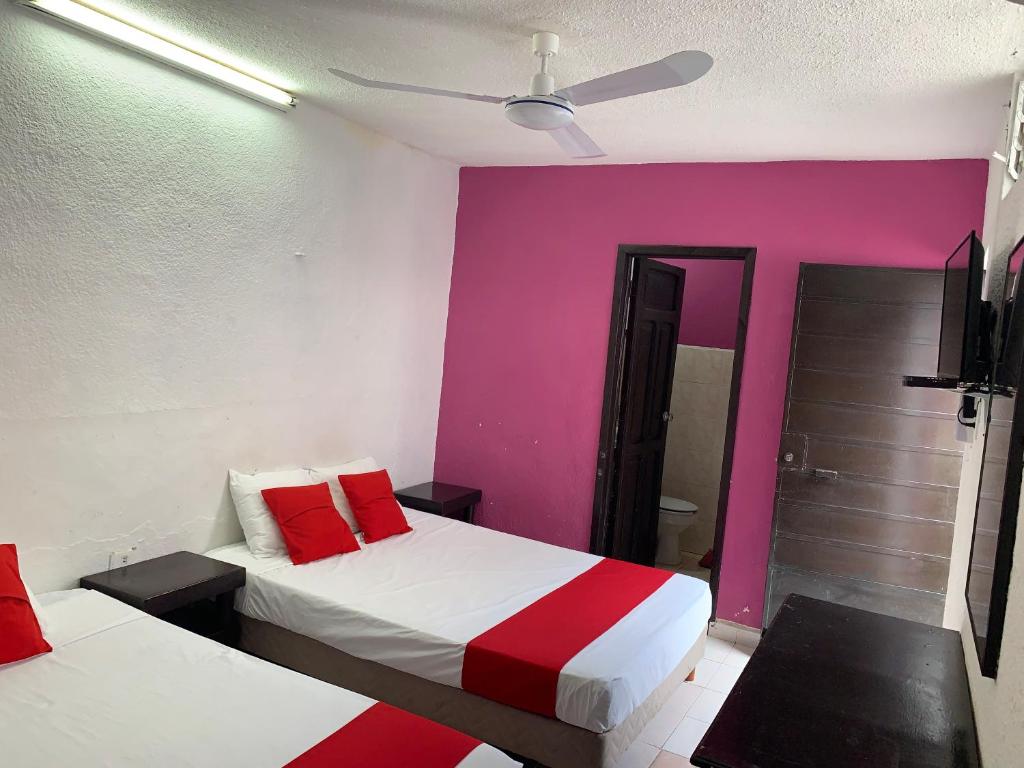 Postel nebo postele na pokoji v ubytování Hotel Aventura
