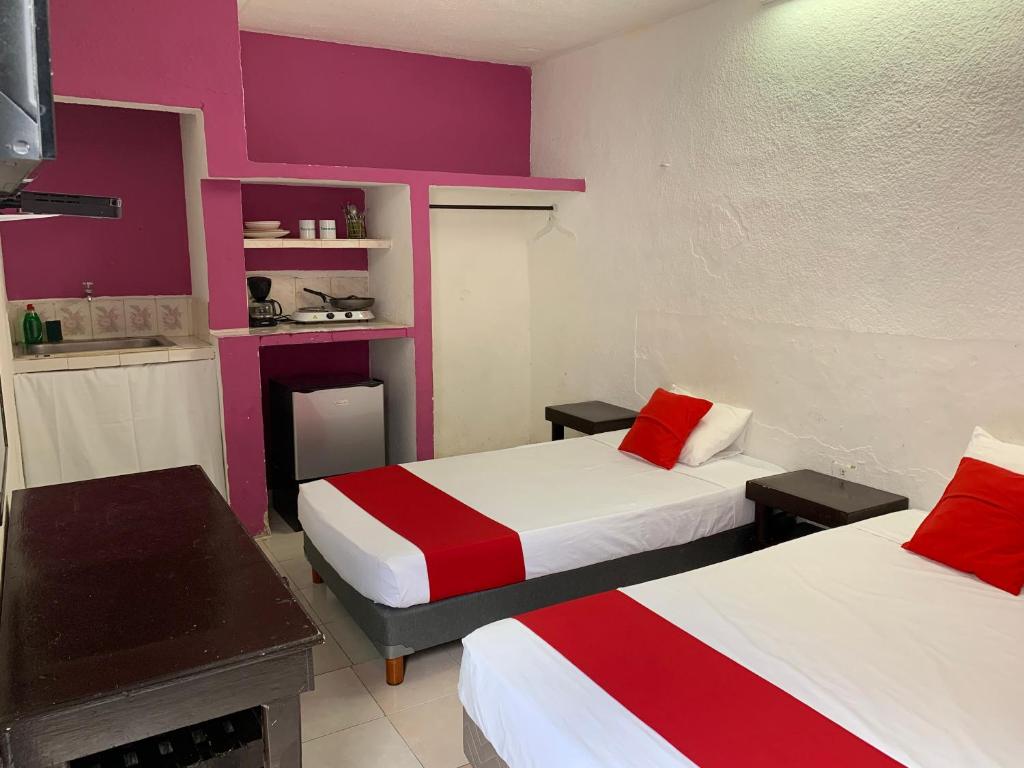 Postel nebo postele na pokoji v ubytování Hotel Aventura