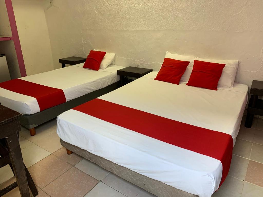 Postel nebo postele na pokoji v ubytování Hotel Aventura