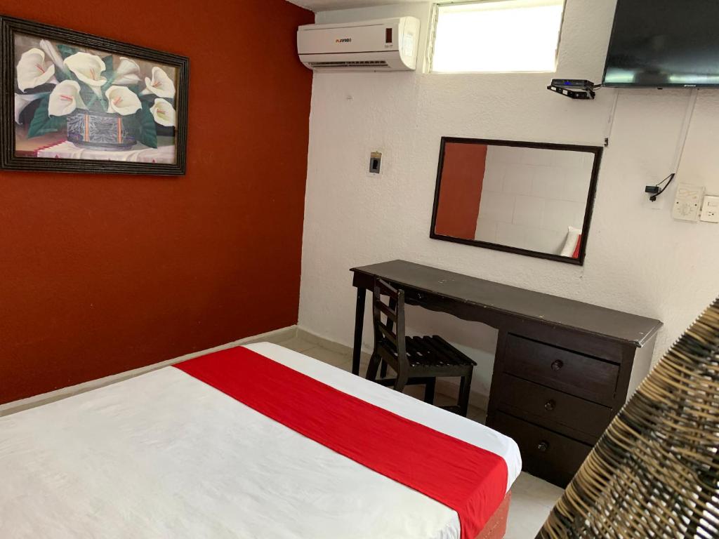 Postel nebo postele na pokoji v ubytování Hotel Aventura