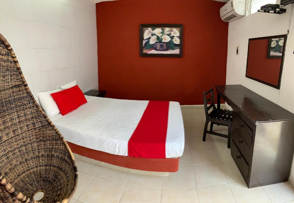 Postel nebo postele na pokoji v ubytování Hotel Aventura