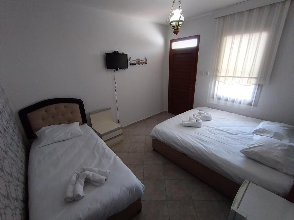 Postel nebo postele na pokoji v ubytování Anz Guest House Pansiyon