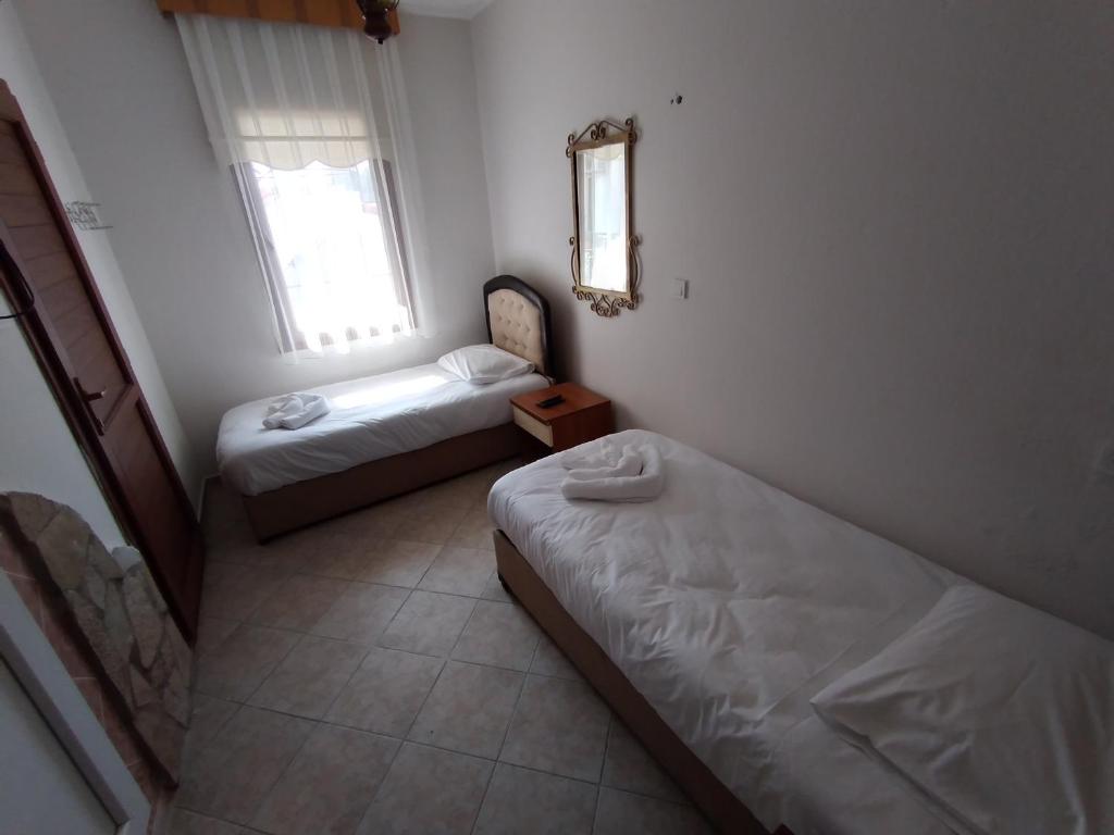 Postel nebo postele na pokoji v ubytování Anz Guest House Pansiyon