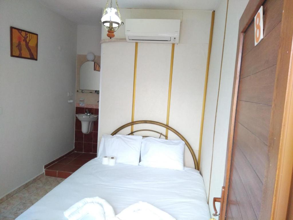 Postel nebo postele na pokoji v ubytování Anz Guest House Pansiyon