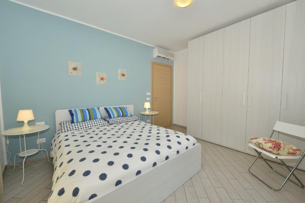 Postel nebo postele na pokoji v ubytování Residence Serenella