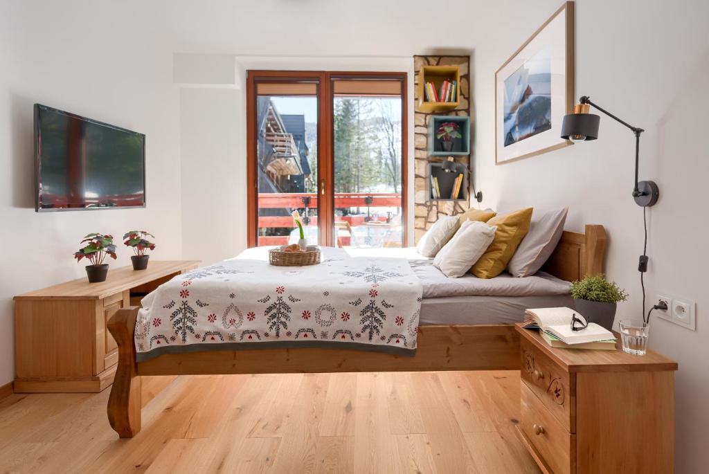 Posteľ alebo postele v izbe v ubytovaní Kościelisko Apartament Przy Dolince