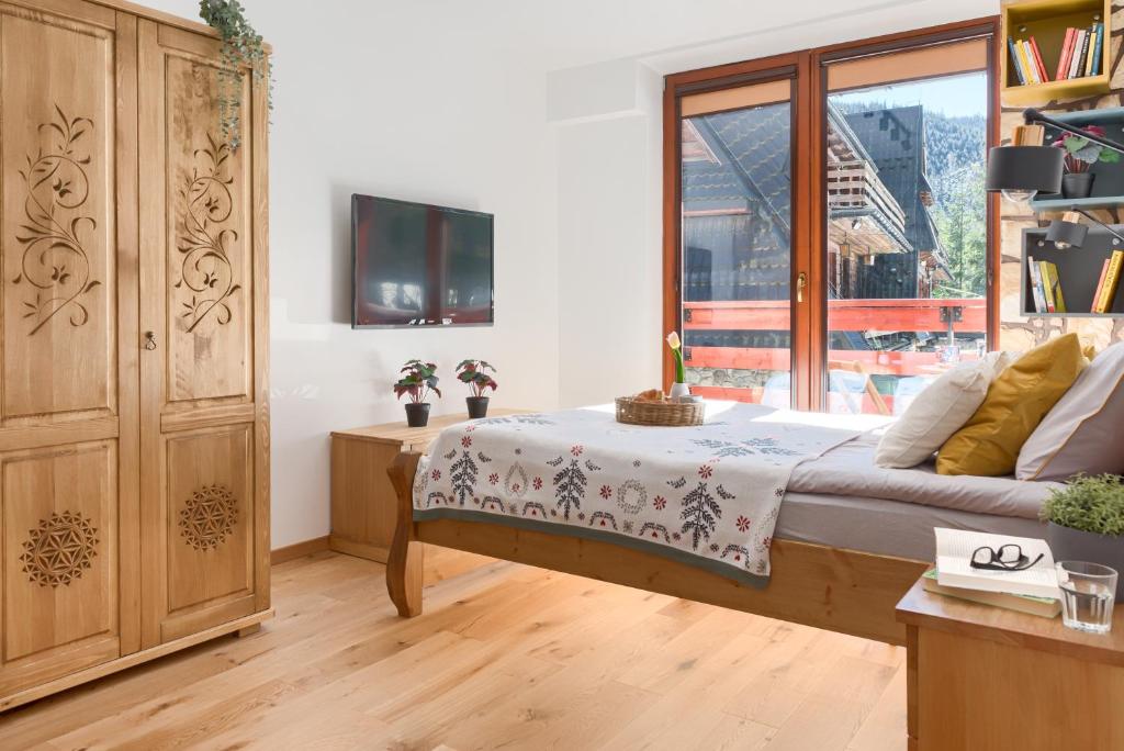 Posteľ alebo postele v izbe v ubytovaní Kościelisko Apartament Przy Dolince