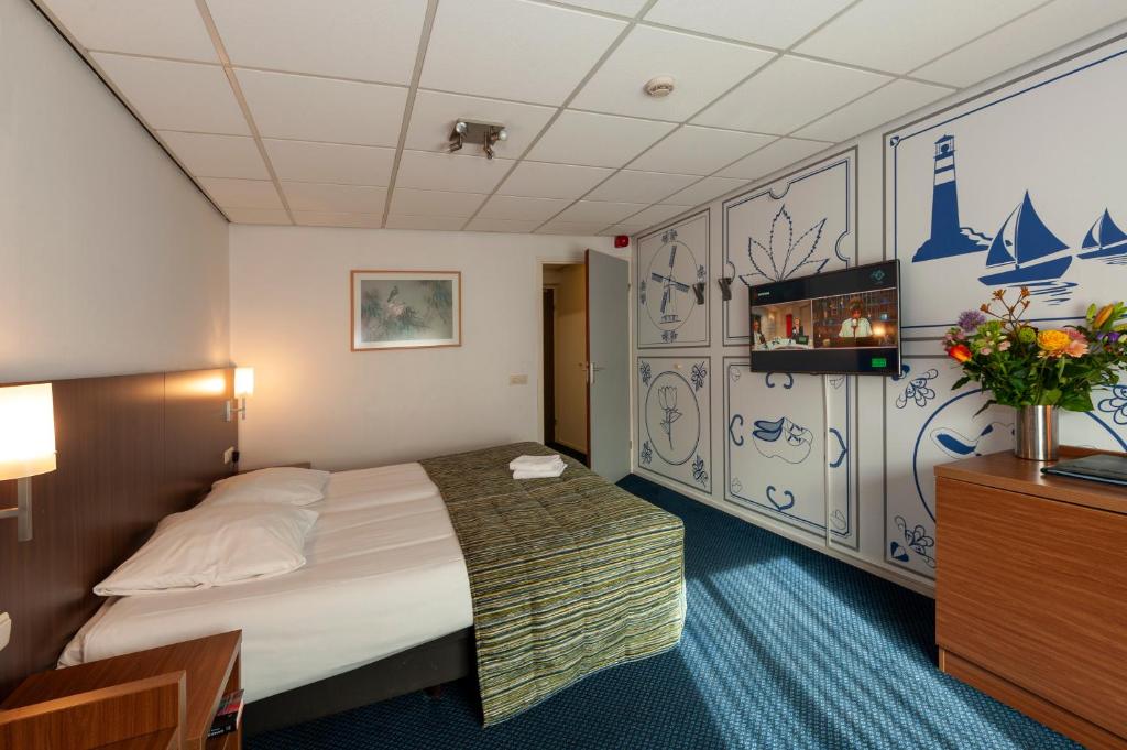 Postel nebo postele na pokoji v ubytování Hampshire Hotel Petit Nord