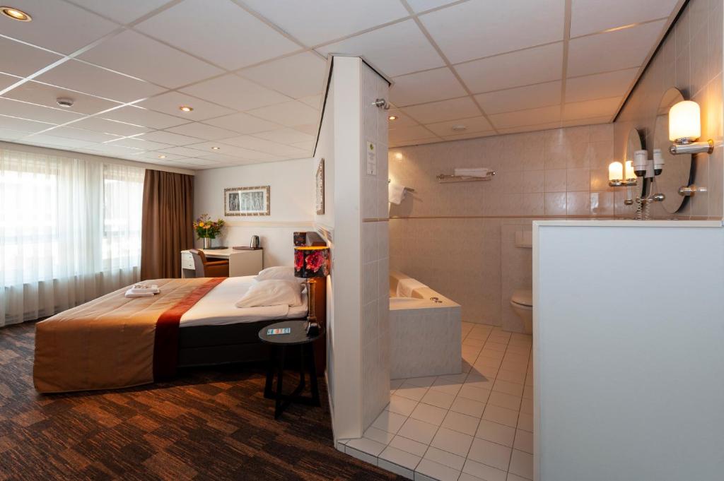 Postel nebo postele na pokoji v ubytování Hampshire Hotel Petit Nord