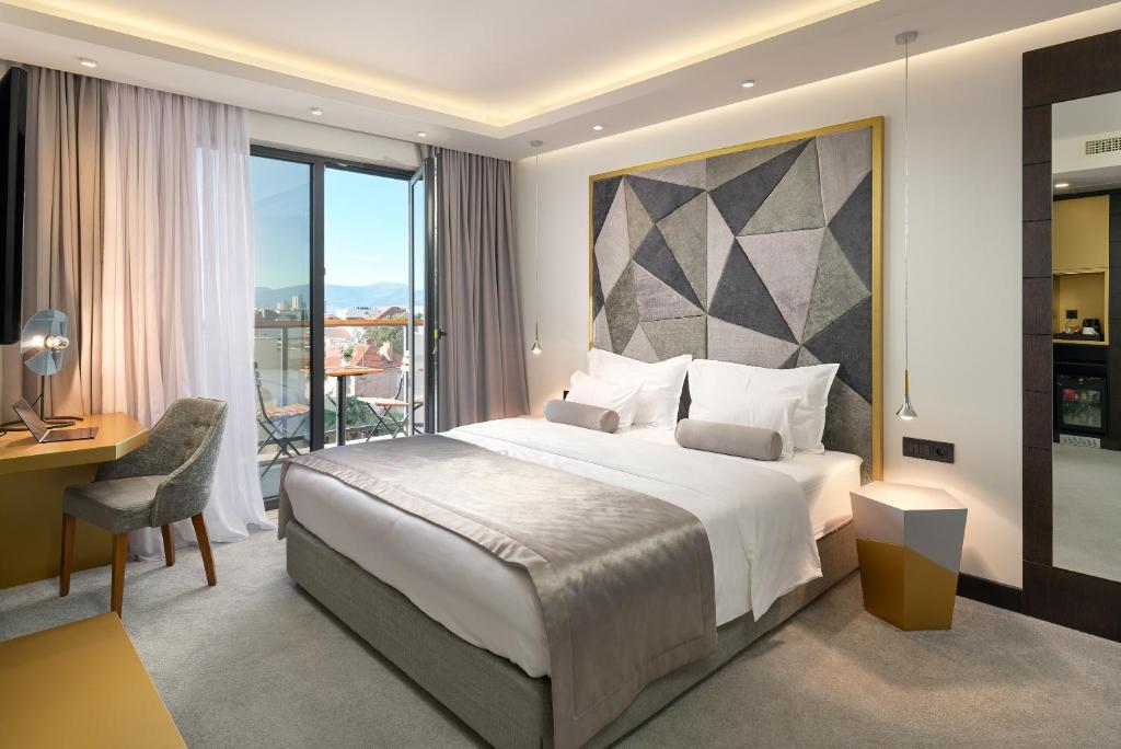 Postel nebo postele na pokoji v ubytování Time Boutique Hotel