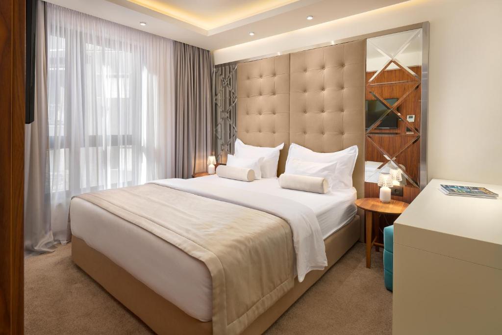 Postel nebo postele na pokoji v ubytování Time Boutique Hotel