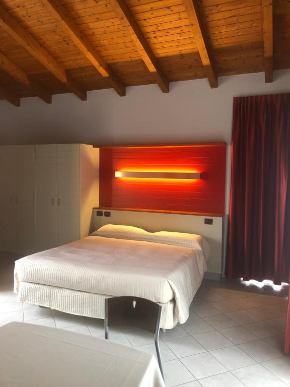 Postel nebo postele na pokoji v ubytování Albavillage Hotel Wellness & Camping
