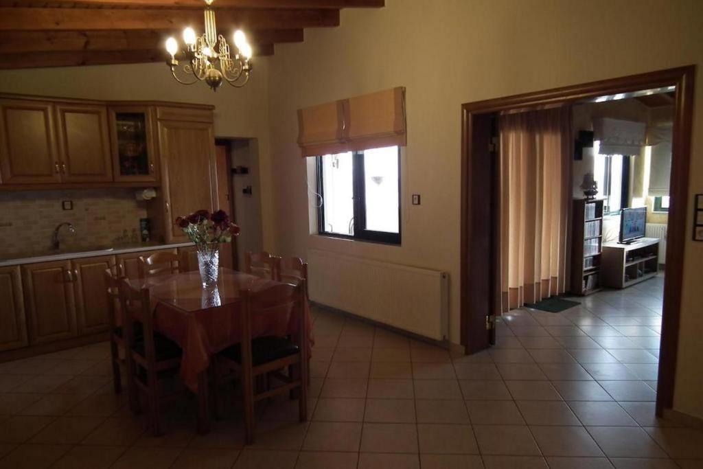 a kitchen and dining room with a table and chairs at Gramvoussa Bay in Kissamos