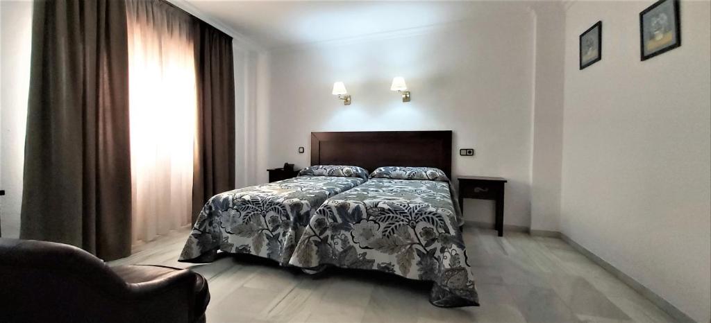 Postel nebo postele na pokoji v ubytování Hotel Averroes