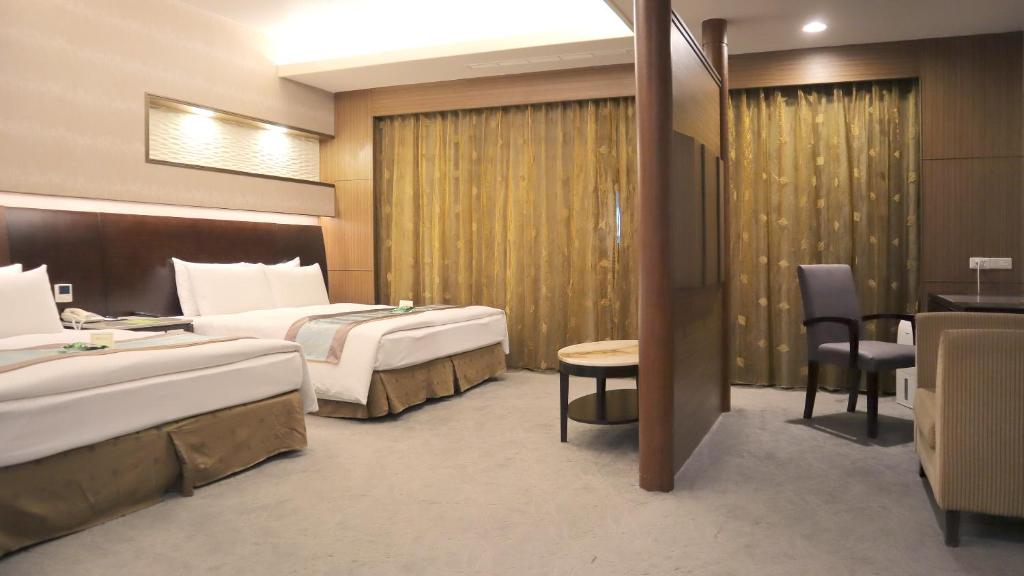 En eller flere senger på et rom på Ho Fong Business Stay