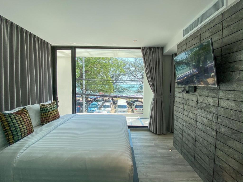 Postel nebo postele na pokoji v ubytování Nirundorn Resort Chaam