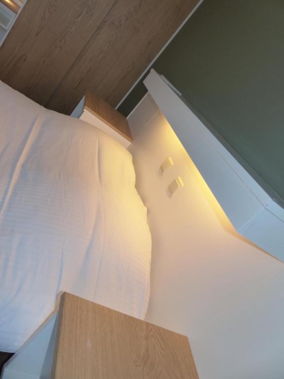 Postel nebo postele na pokoji v ubytování Logis Hotel Du Midi
