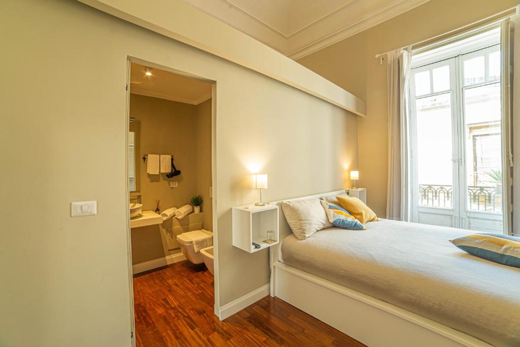 Postel nebo postele na pokoji v ubytování b&b le 4 leggende
