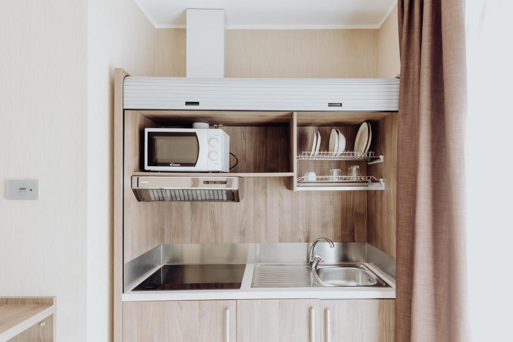 Kuchyň nebo kuchyňský kout v ubytování Privilege Apartments