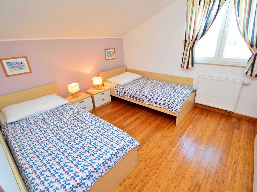Posteľ alebo postele v izbe v ubytovaní Apartment Cvita-2 by Interhome
