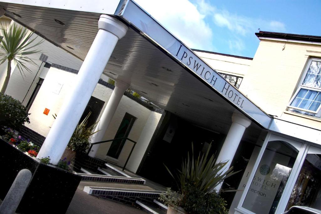 a building with a sign that reads harmony house at Best Western Ipswich Hotel in Ipswich