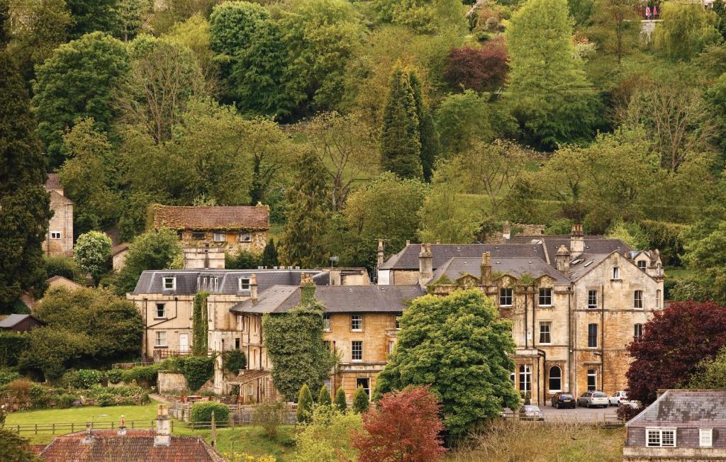 a small town with a large stone building at Best Western Limpley Stoke Hotel in Bath