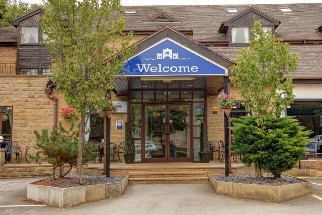 a welcome sign in front of a building at Hotel St Pierre, Sure Hotel Collection by Best Western, Newmillerdam, Wakefield in Wakefield