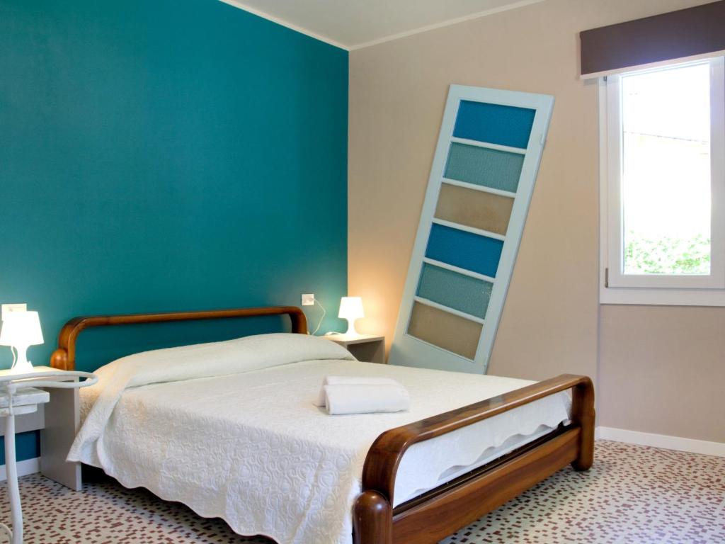 Łóżko lub łóżka w pokoju w obiekcie Holiday Home Fior di Sole by Interhome