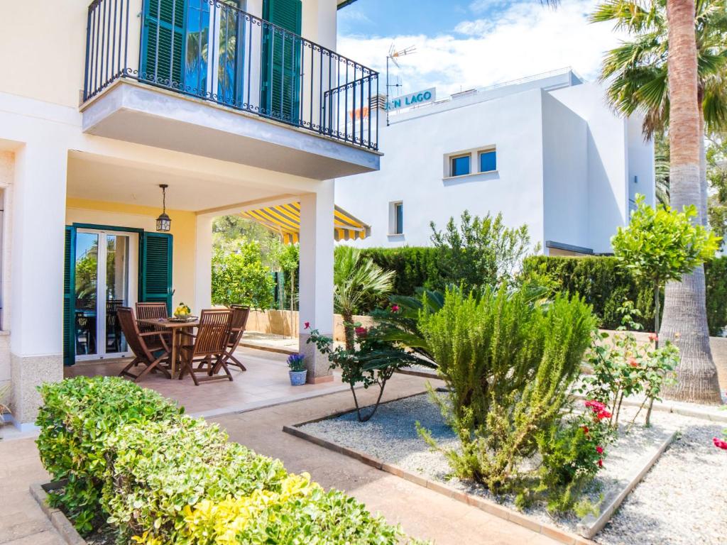 a villa with a balcony and a patio at Holiday Home Les Savines by Interhome in Alcudia