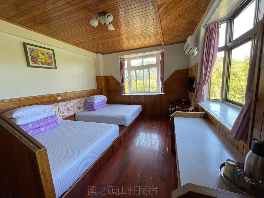Postel nebo postele na pokoji v ubytování Xi Zhi Tou Homestay