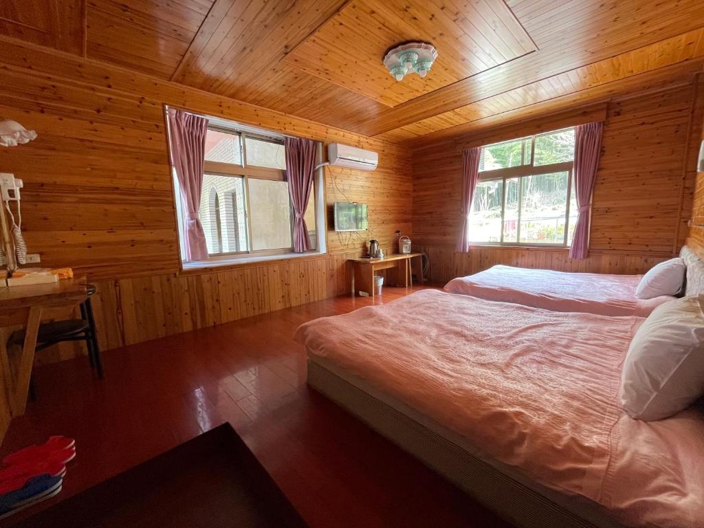Postel nebo postele na pokoji v ubytování Xi Zhi Tou Homestay