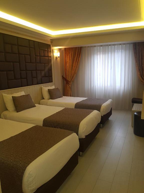 Postel nebo postele na pokoji v ubytování Martinenz Hotel