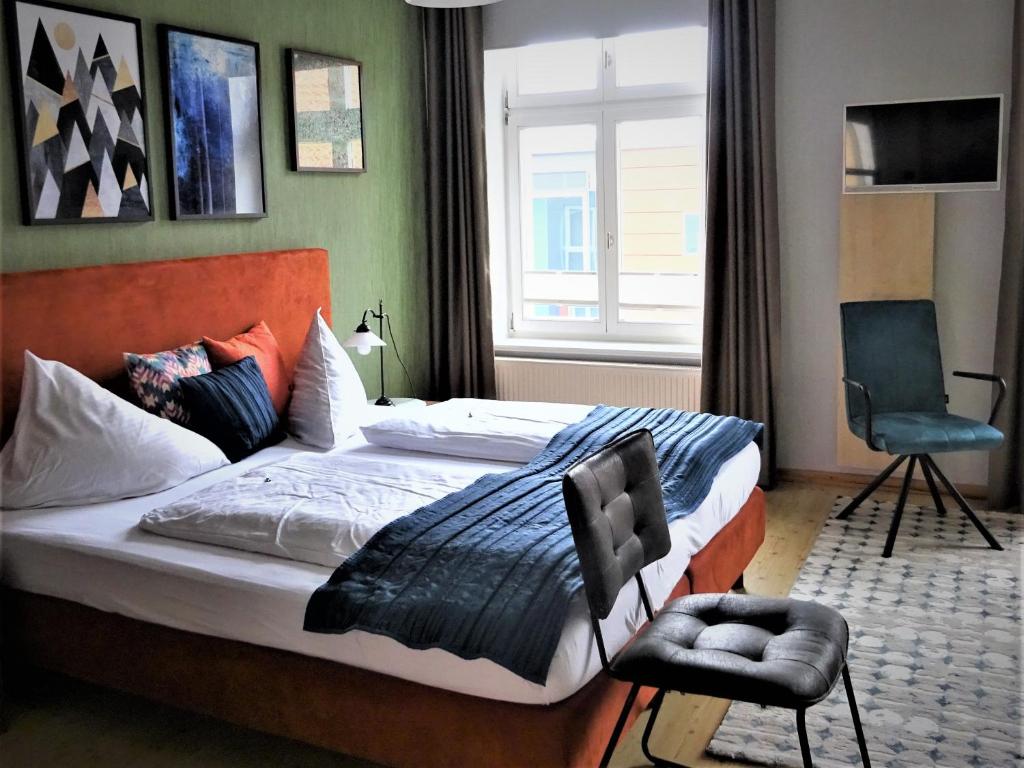 Postel nebo postele na pokoji v ubytování Hotel Pension Zur Fährbrücke