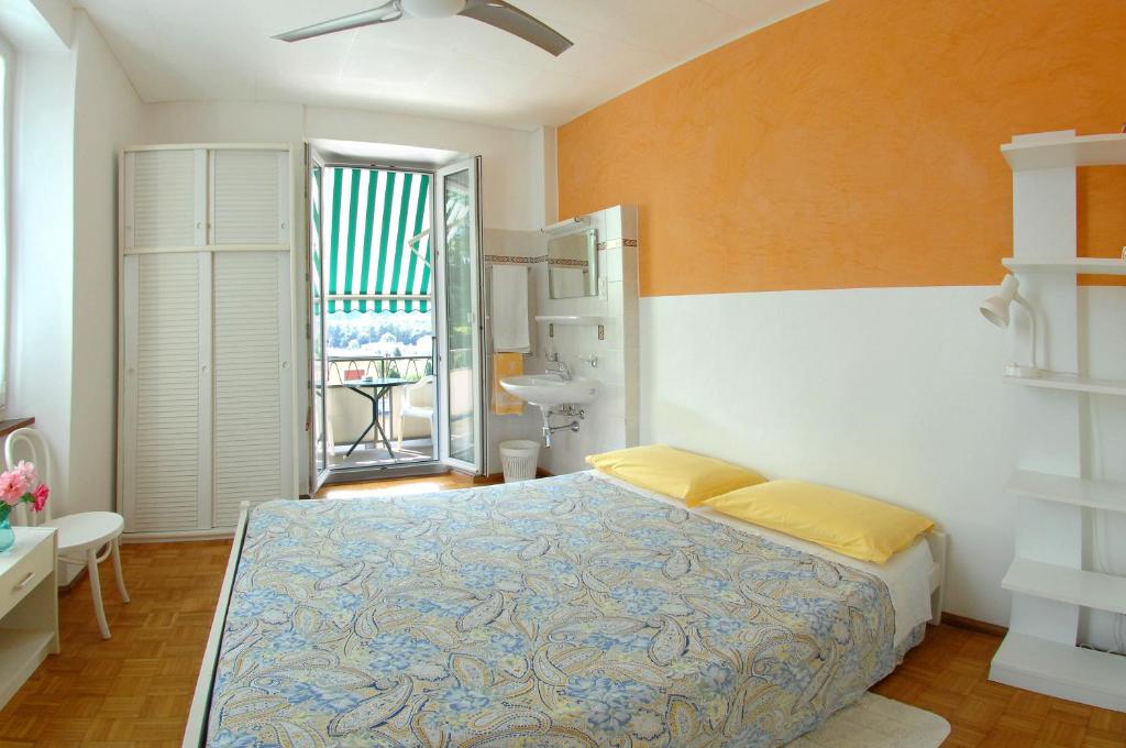 Giường trong phòng chung tại Osteria Garni Americana