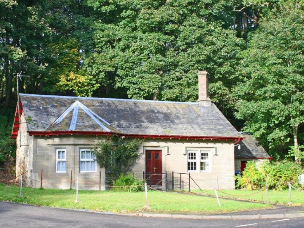 a small house on the side of the road at Holiday Home Craigton Cottage by Interhome in Dunkeld