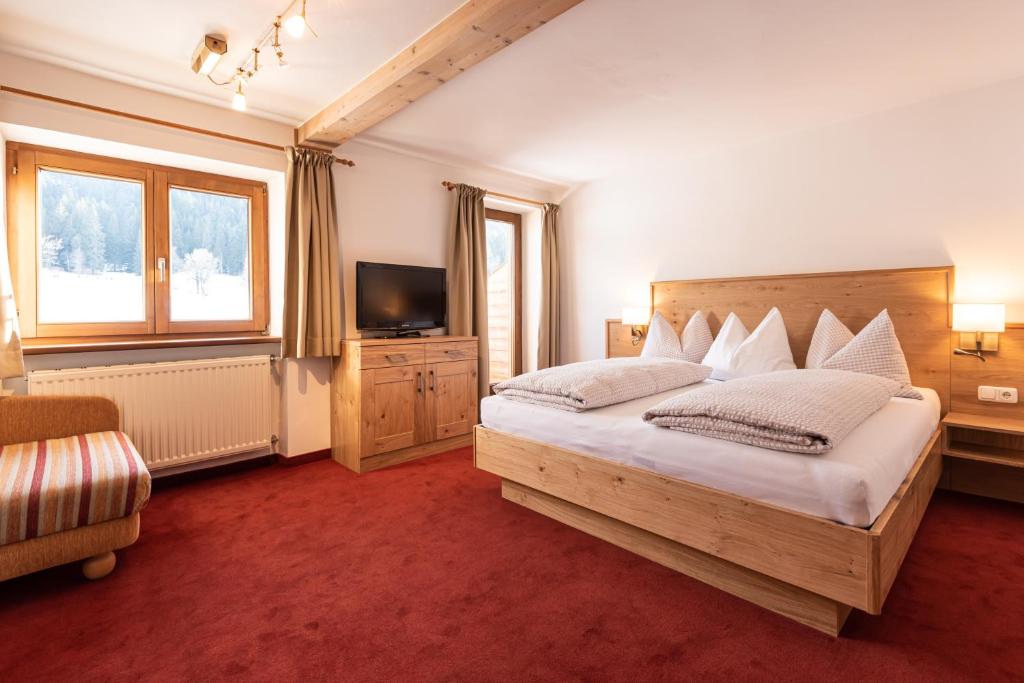 Postel nebo postele na pokoji v ubytování Apartments Foidl