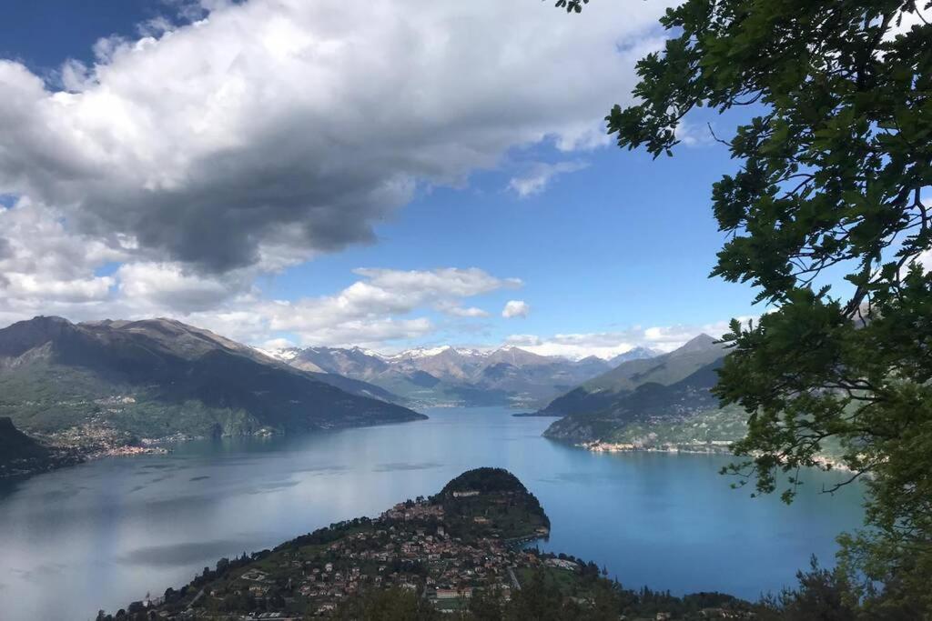 a view of a large body of water with mountains at TRADITIONAL VILLA BELLAGIO san primo LAKE COMO in Bellagio