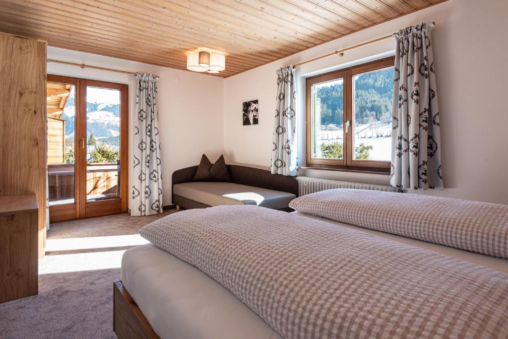 Postel nebo postele na pokoji v ubytování Apartments Foidl