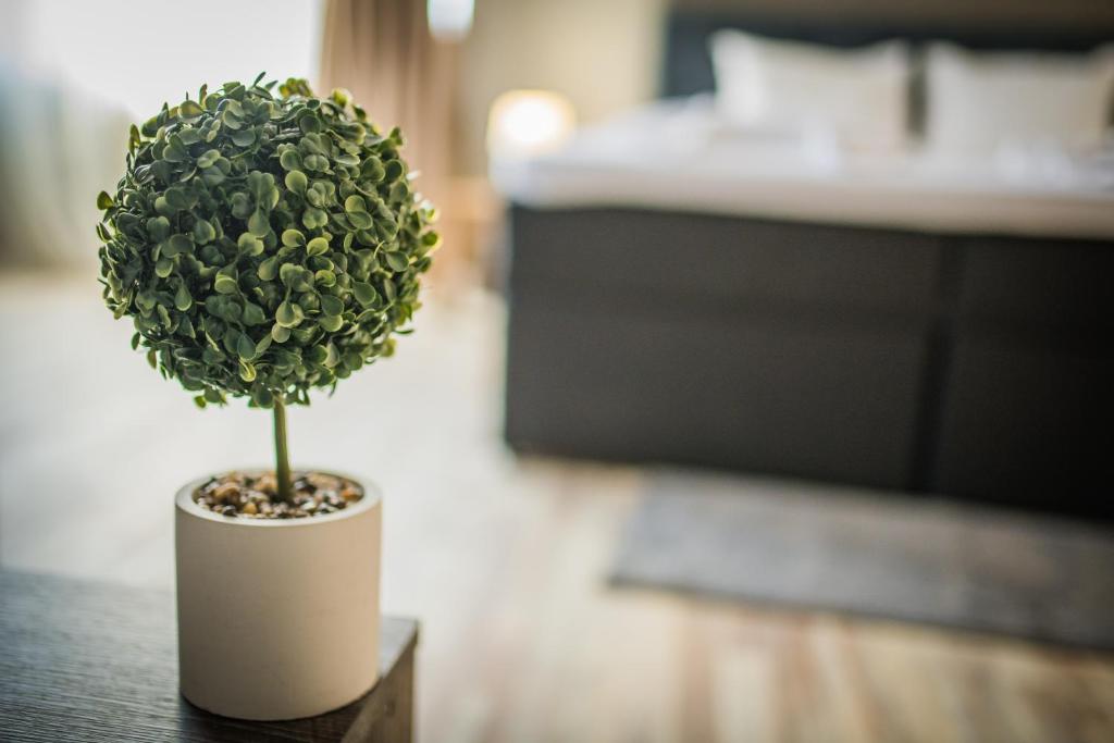 Postel nebo postele na pokoji v ubytování Vida Family Hotel