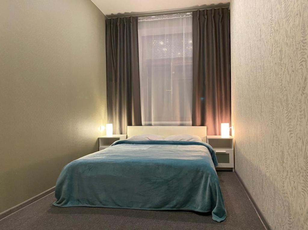 Cama o camas de una habitación en Severnaya MIni-Hotel