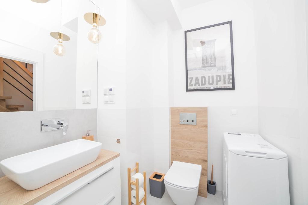 Kúpeľňa v ubytovaní Mrągowo dwupoziomowy Apartament Indygo 85m2 z widokiem na jezioro