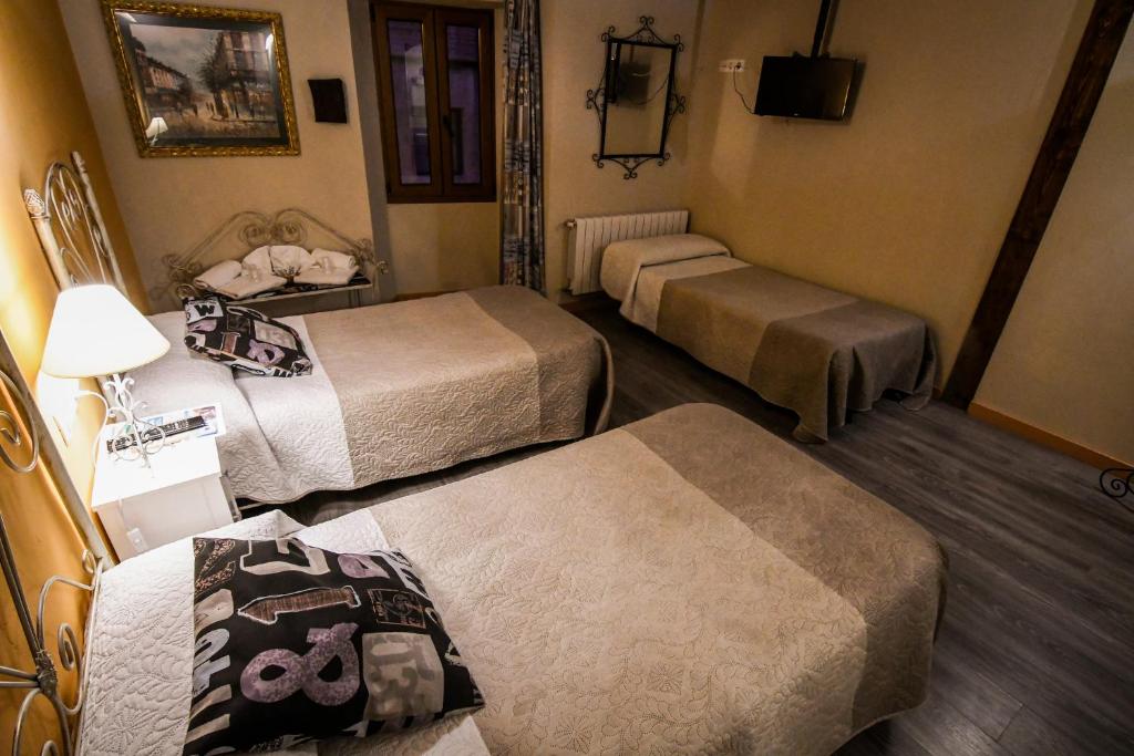 Postel nebo postele na pokoji v ubytování aCienLeguas