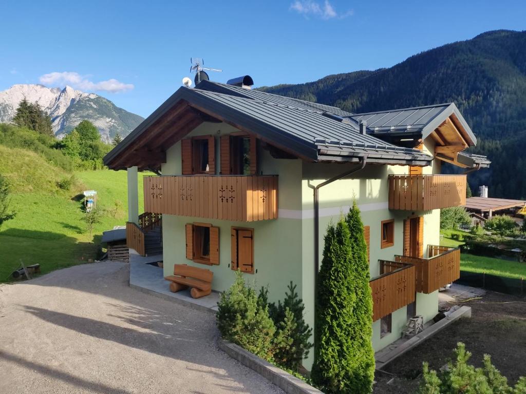 a house with solar panels on the roof at Belvedere in Auronzo di Cadore