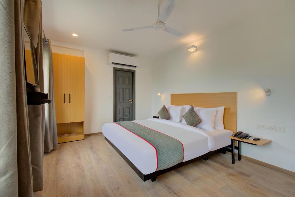 Postel nebo postele na pokoji v ubytování Hotel Maitrayee