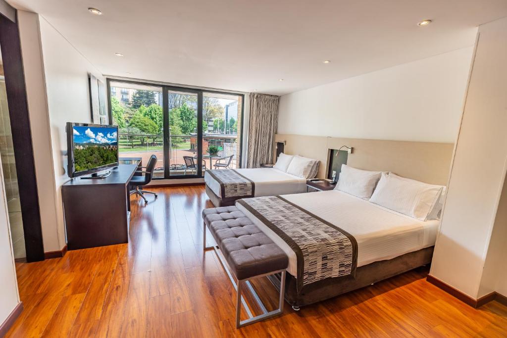 Postel nebo postele na pokoji v ubytování Hotel Jazz Apartments