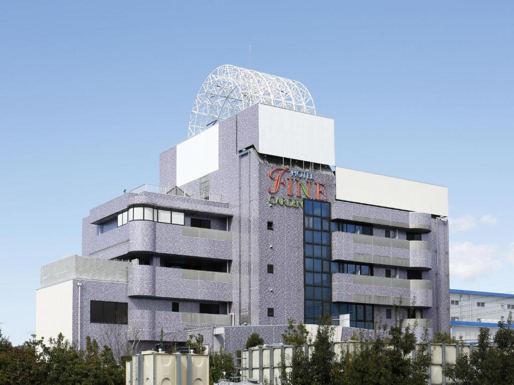 a building with a sign on the top of it at Hotel Fine Garden Gifu in Kakamigahara