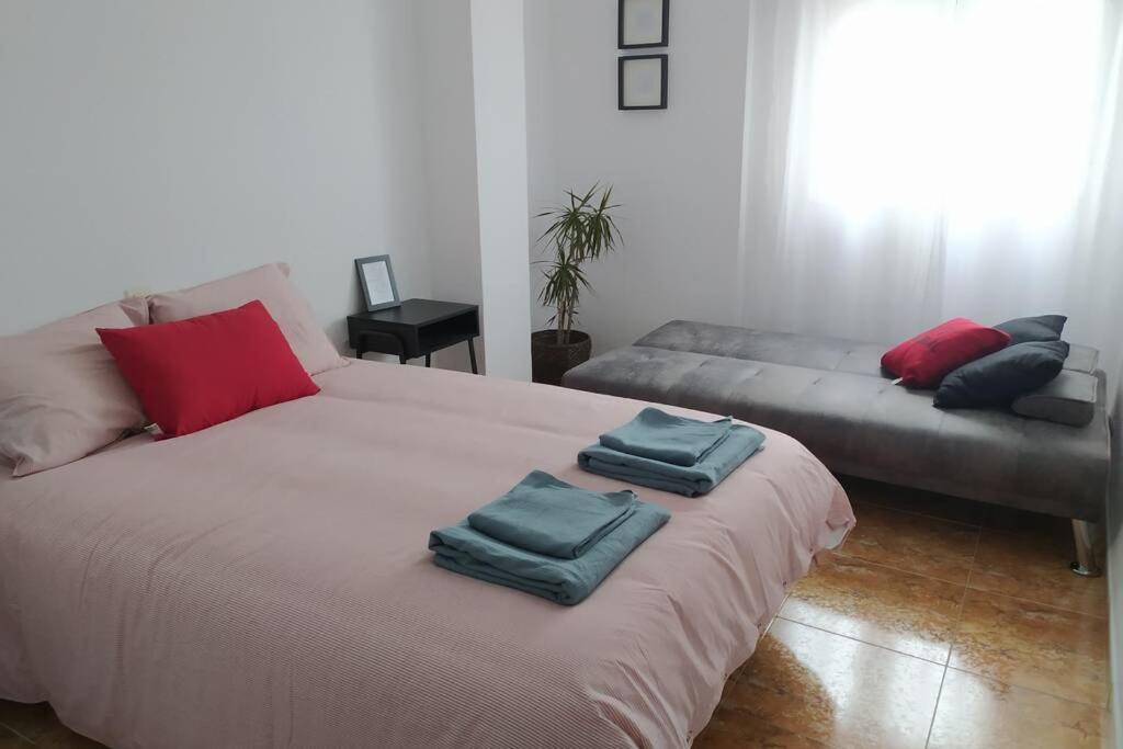 Posteľ alebo postele v izbe v ubytovaní Amplio y céntrico apartamento junto al mar