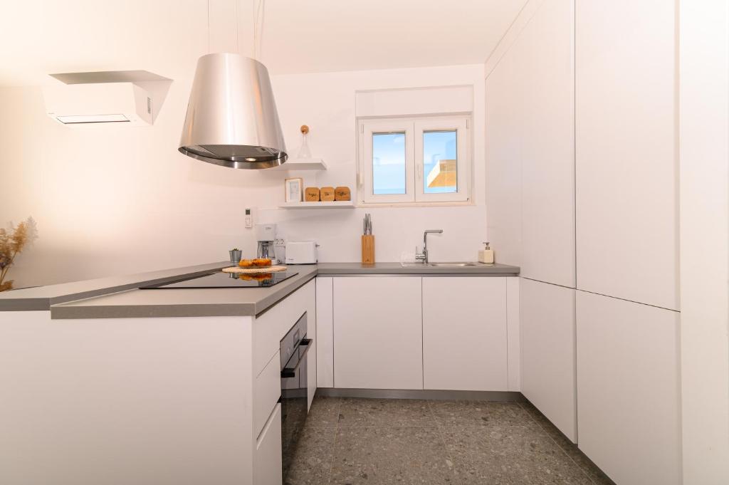 Kuchyňa alebo kuchynka v ubytovaní Hygge Boutique Apartment