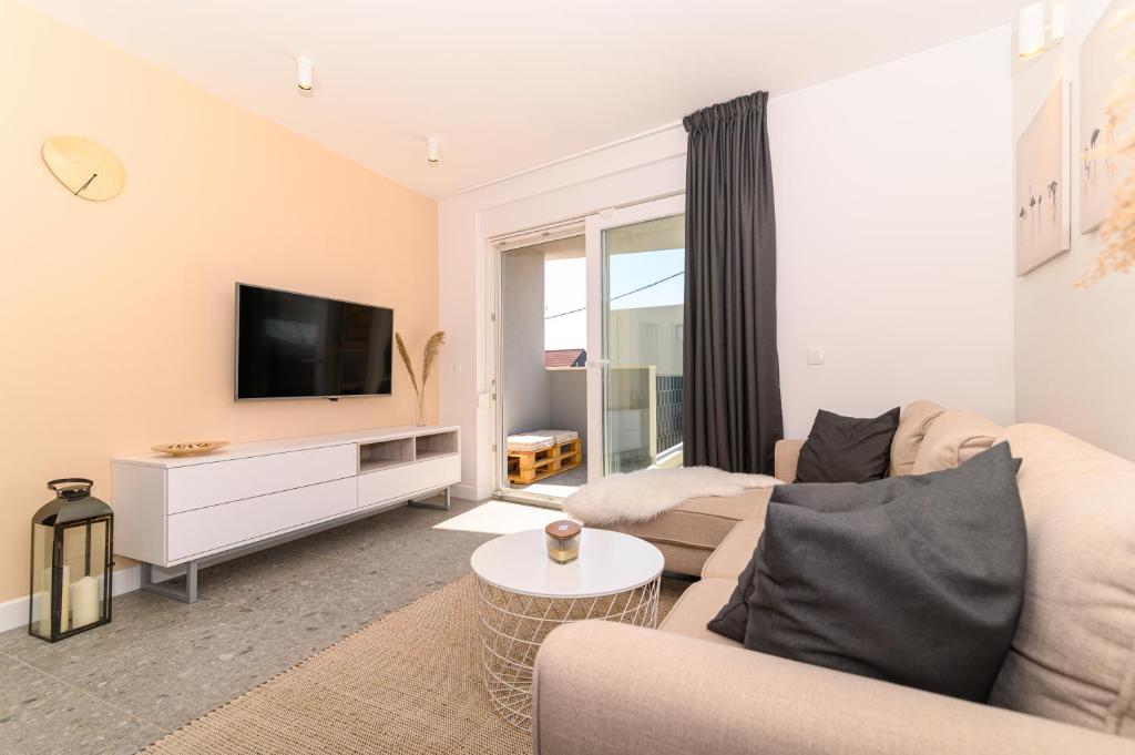 Televízia a/alebo spoločenská miestnosť v ubytovaní Hygge Boutique Apartment